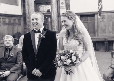Slice of Life Photography - Bride and Groom laughing during wedding ceremony at Boston Registry office