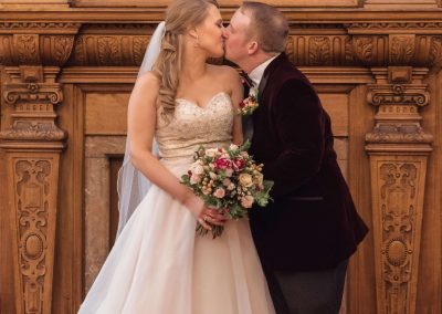 Slice of Life Photography - Bride and groom sharing a kiss at Boston registry office