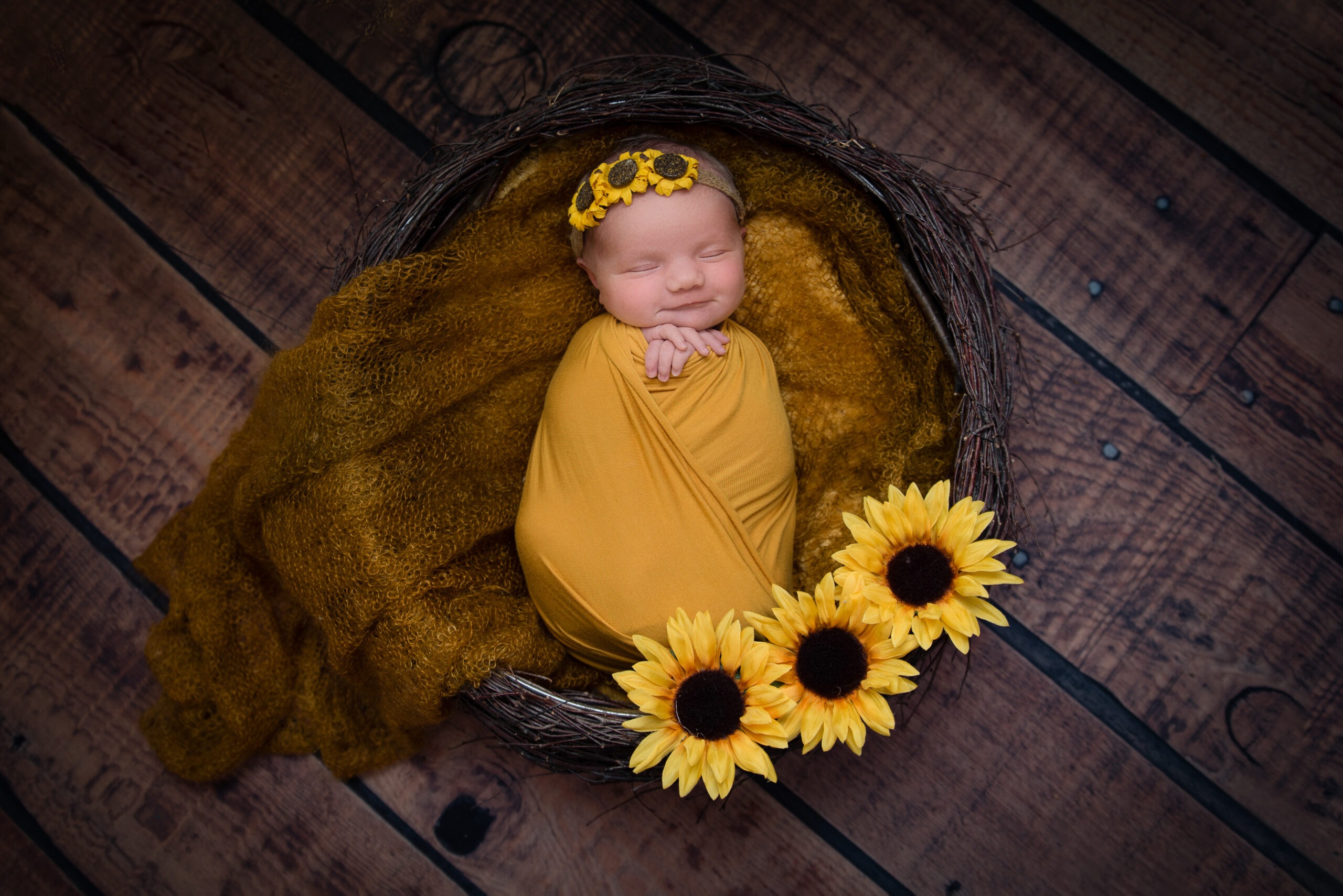 newborn twin photoshoot babies being cuddled by big brother